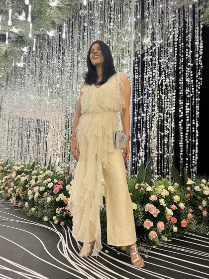 This ruffled jumpsuit was perfect for dancing the night away at a sangeet. The flowing fabric and comfortable fit made it both stylish and practical for a long night of celebrations.