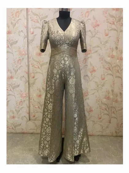 A unique Banarasi brocade silk jumpsuit. This fusion piece combines the richness of traditional fabric with a modern, wide-leg jumpsuit silhouette.