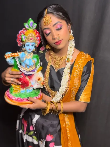 The complete look, featuring a printed half saree with traditional gold jewelry. This outfit is perfect for devotional events or festive photoshoots.