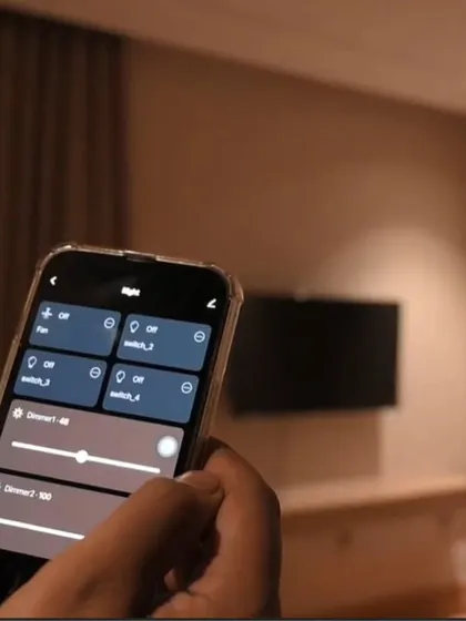 The app interface shows controls for the fan, multiple switches, and two separate dimmer sliders, giving granular control over a bedroom's environment.