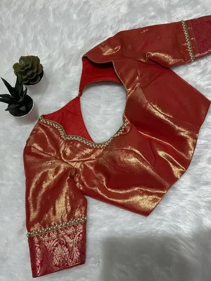 Gold meets bold! This orangish-red stunner isn’t just a blouse, it’s a whole vibe.