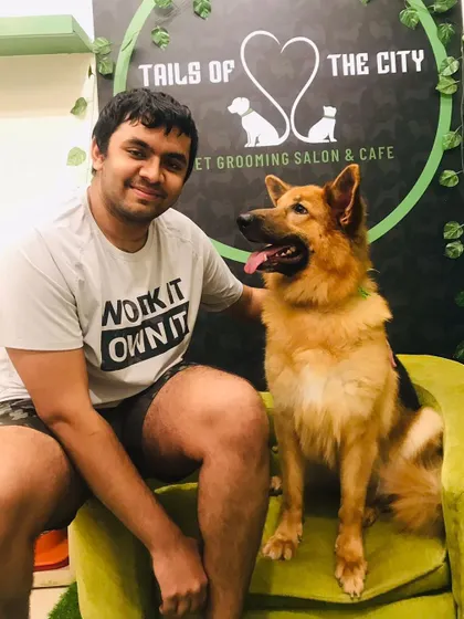 Begum the German Shepherd posing proudly with her owner. A well-groomed dog is a happy companion.