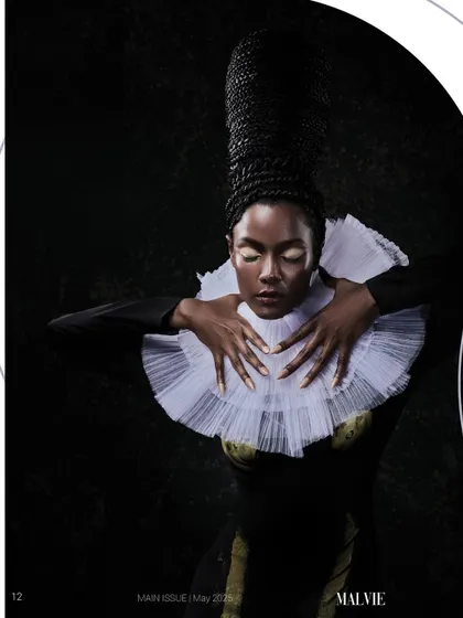 A regal and artistic shot for Malvie Magazine, featuring avant-garde hair and a dramatic collar.