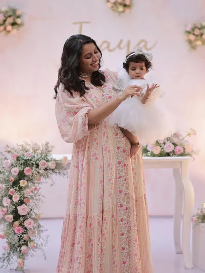 Another beautiful shot of the mother and daughter, capturing the love and joy of the celebration.