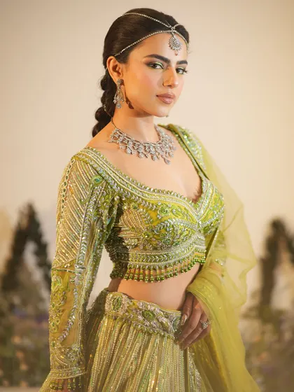 Another angle of this beautiful Mehendi look. The braided hair and glowing makeup create a perfect festive look.