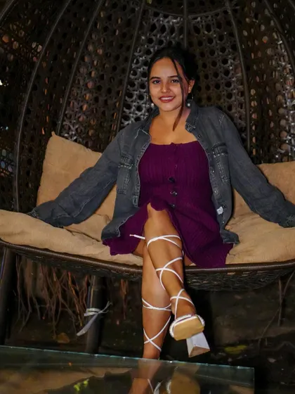 Chilling out in style. A guest relaxing in one of Pebble's cool hanging chairs, soaking in the atmosphere.