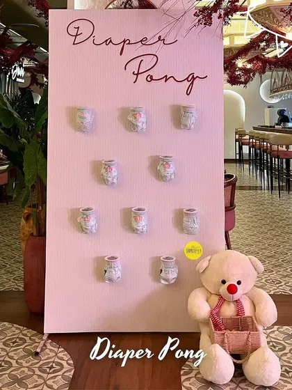 Our "Diaper Pong" game setup, ready for some friendly competition. It's a simple, fun activity that always gets a lot of laughs at baby showers.