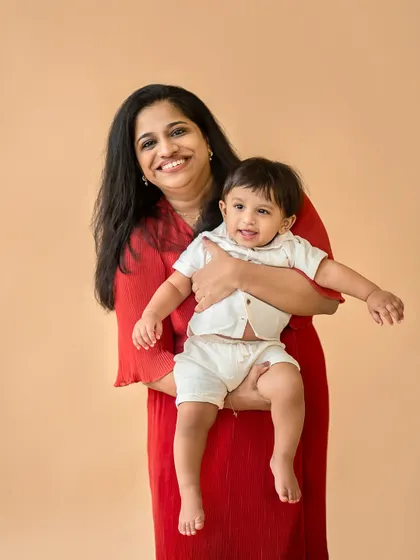 A beautiful mother and child portrait. The baby's happy expression and the mother's loving smile say it all.