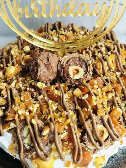For the ultimate chocolate hazelnut lover, I created this Choco Rocher Tres Leches. It's a decadent treat crowned with crunchy hazelnut praline and Ferrero Rocher chocolates.