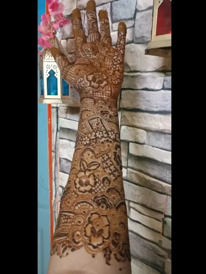 A recent full-sleeve mehendi design, showcasing the level of detail and coverage I can provide.