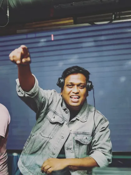 Pointing to the crowd, acknowledging their energy. The party is a two-way street, and I love giving shout-outs and making people feel seen.