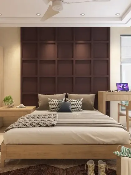 A cozy bedroom with natural wood tones and a dark brown grid-paneled accent wall, complete with a corner study desk.