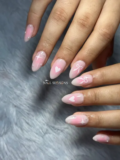 A dreamy, Pinterest-inspired set with a soft pink aura base and delicate white hearts, bows, and sparkles.