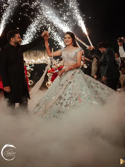 Making the couple's entrance unforgettable. I used a combination of low-lying fog and cold-pyro sparklers to create this dramatic and dreamy effect as they made their way to the dance floor.