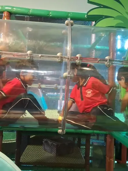 Students from Little Star Home School exploring our transparent crawl tunnel. It's one of the many exciting features that make our play structure an adventure for curious minds.
