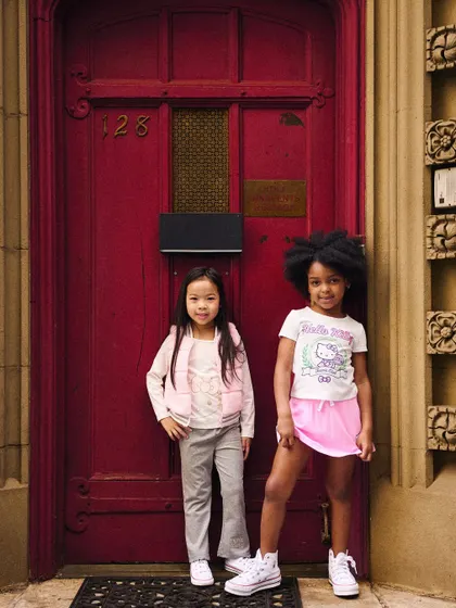 Using a bold red door as a backdrop, this simple portrait of two girls stands out. The colors pop, and the composition is clean and effective.