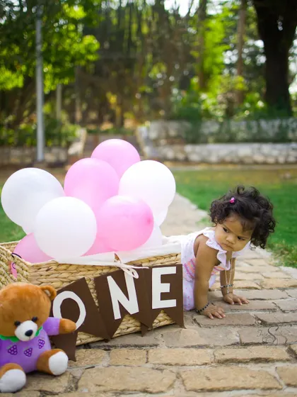 Capturing the crawling stage is just as important. This shot shows the little one on the move during her first birthday session, a testament to how much they grow in one year.