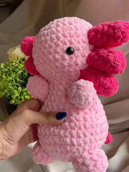 A side view of the handmade axolotl toy. This magical creature is one of our more unique designs and has been a huge hit with those who love rare and exotic animals.