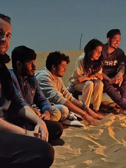 Another cozy campfire scene in the desert. These evenings are a core part of our trips, offering a chance to connect with fellow travelers.