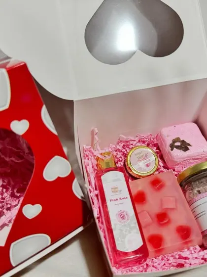 This is our classic Valentine's Day hamper, filled with everything needed for a romantic pamper session. It includes a 3D transparent heart soap, a rose bath bomb, organic lip balm, pink rose bodywash, and rose bath salts in a lovely heart-themed box.