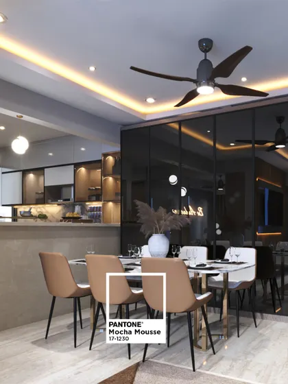 Here, the warm "Mocha Mousse" color is used on the dining chairs, pairing beautifully with the dark, reflective wall panels and a marble-topped table for a sophisticated dining experience.