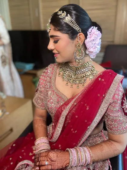 A side view of the bride, showing off her beautiful smile and elegant hairstyle.