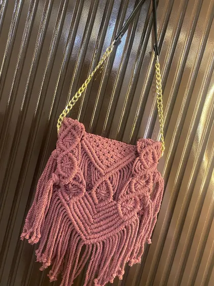 Here is the same fringed boho bag styled with the elegant gold chain and leather strap. This small change makes it suitable for an evening out.