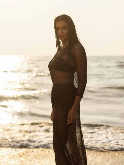 A silhouette against the sunset, a classic and beautiful way to showcase the lines of an outfit.