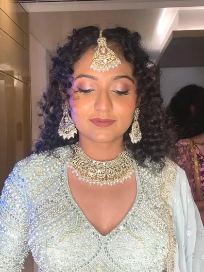 A close-up of the shimmery eye makeup for this engagement look. The soft pink and silver tones create a romantic and celebratory feel.
