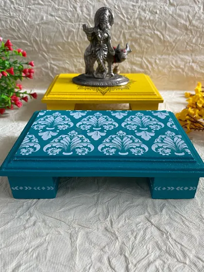 This set of two chowkis, one with a mandala and the other with a damask pattern, is a popular choice for gifting.