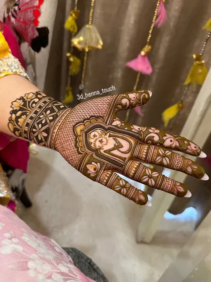 A single-hand Karwa Chauth design featuring a portrait of a woman within an ornate frame. This is a great option if you want a detailed story on one hand and a simpler pattern on the other.