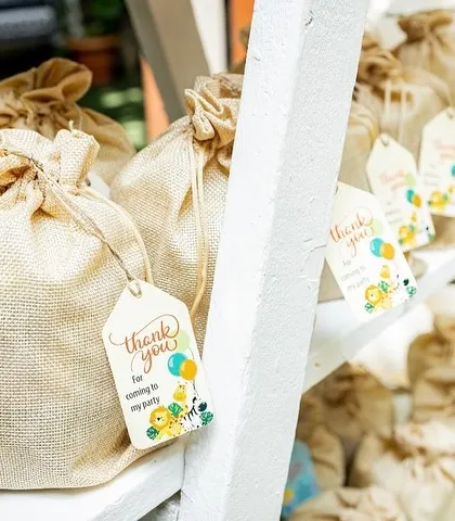 A little detail shot of the party favors. These personalized "thank you" bags are a thoughtful touch that adds to the story of the day's celebration.