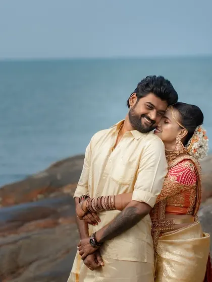 Capturing the warmth and affection of a beachside wedding. The bride's gentle whisper and the groom's happy smile tell a story of comfort, love, and the beginning of their journey by the sea.
