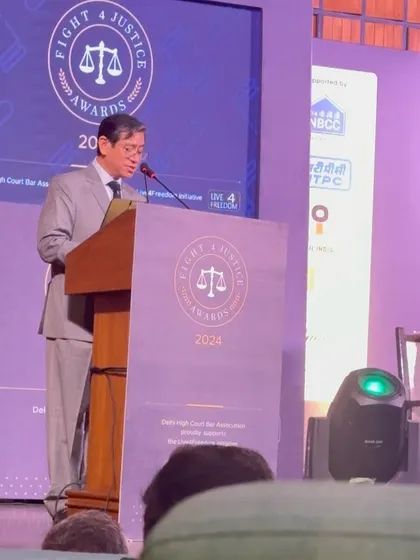 A speaker addressing the audience at the "Fight for Justice" awards, an inspiring evening for the legal community.