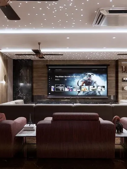 A full view of the home theatre, showcasing the combination of a large sofa and plush recliners. The starlight ceiling and warm wall sconces create an immersive and cozy viewing experience.