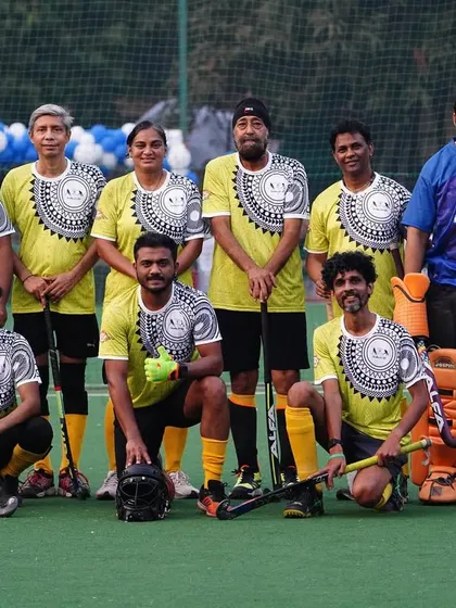 A team in yellow and grey jerseys poses before their match. The variety of teams and players at these events is what makes them so special.