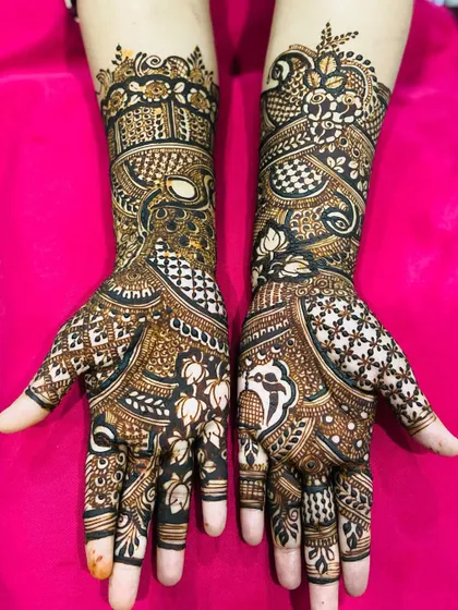 A detailed shot of a traditional Rajasthani-style henna, known for its dense patterns and motifs inspired by nature and royalty.