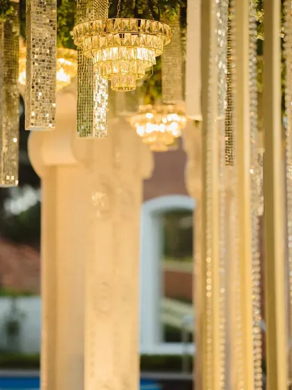 A detailed view of the hanging decor elements. I mixed mini crystal chandeliers with mirrored tassels to create a ceiling installation that sparkled and reflected light beautifully.