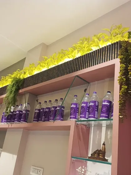 To liven up this retail shelving display, I added a custom-lit planter box filled with bright artificial greenery. It’s a simple touch that draws attention and adds a premium feel to the product display.