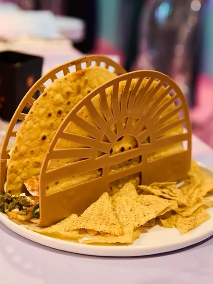 A closer look at our designer tacos from the Ajio Luxe pop-up. The custom holder not only looks great but is functional, making it a perfect bite for a stylish, social event.