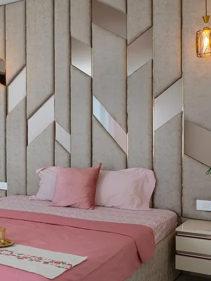 From this angle, you can see the interplay of light and texture on the headboard and the fluted wall panel. Every detail is chosen to contribute to a feeling of refined comfort.