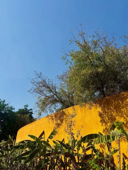 The vibrant yellow walls contrast beautifully with the deep blue sky, a sight that energizes and calms in equal measure.