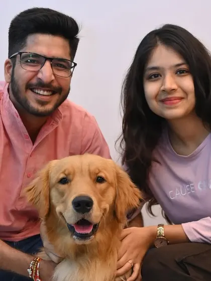 A happy family with their Golden Retriever at our Ahmedabad center. It's always a joy to see our community grow.