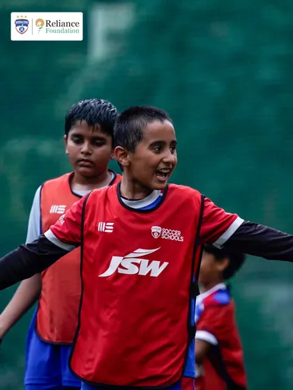 A player communicates with his teammates during a match. We teach the importance of on-field communication and teamwork from a very young age.