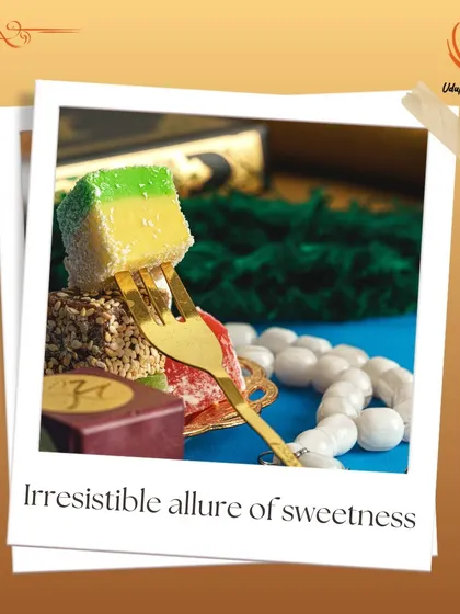 The irresistible allure of sweetness. This image showcases a colorful Indian sweet on a golden fork, representing the rich and diverse dessert options we provide for all events.