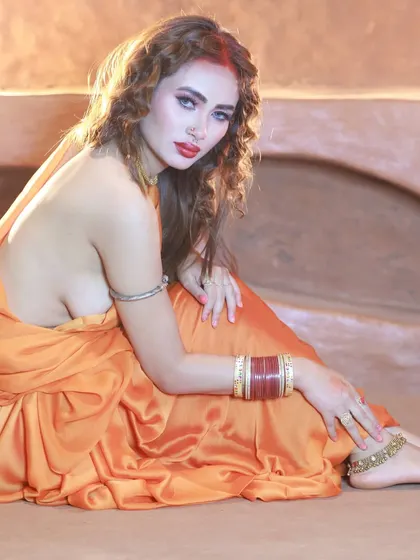 A side profile shot that showcases the unique, blouseless draping of the saree. This is for collaborators who want to create something edgy and different.