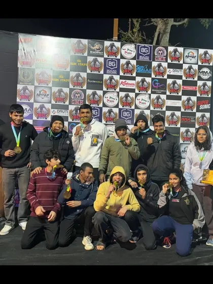 This is our family. A team of champions celebrating a massive haul of medals at the Elite Combat MMA championship in Ajmer. We train together, we win together.