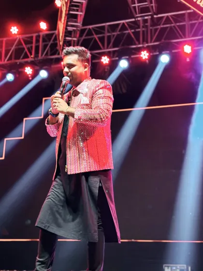 Another angle from a power-packed Sangeet night. The stage is my playground, and I use every inch of it to engage with the audience and keep the vibe electric.