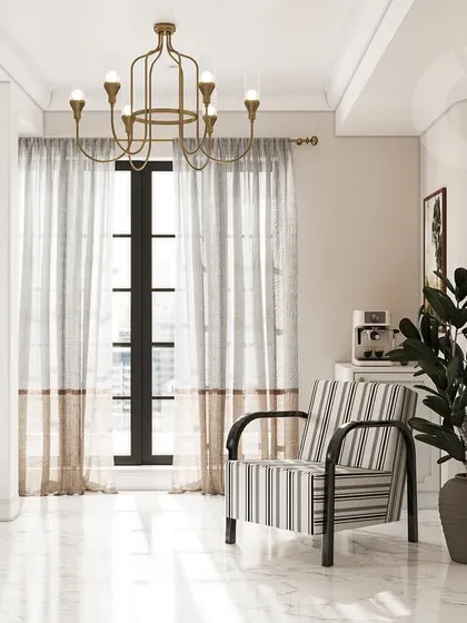 A quiet reading corner in the master bedroom. The striped armchair, classic chandelier, and full-length mirror are carefully chosen to create a sophisticated nook that feels both timeless and comfortable, enhanced by natural light from the large window.