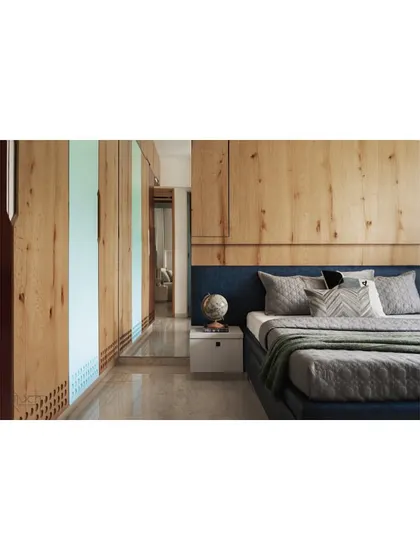 Another view of the teenager's room, showing the full expanse of the wooden wardrobe and wall panels.